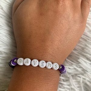 This is a ravens clay bead bracelet and it’s homemade!